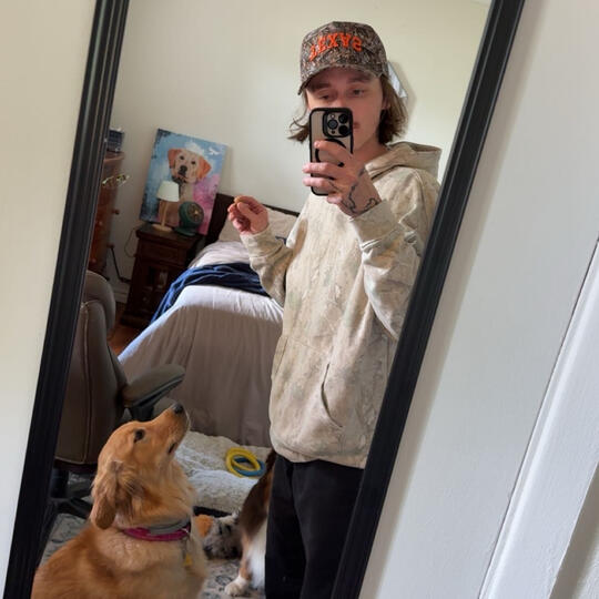 Me and my pup Xena! photo of caleb mcreynolds and his yellow labrador Xena